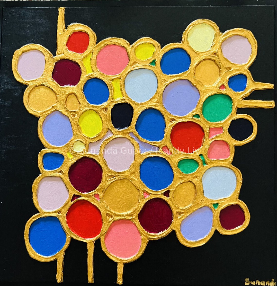 Textured canvas with gold circles filled with colour